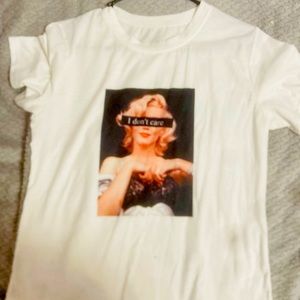 White trendy tee-shirt (“I don’t care”)